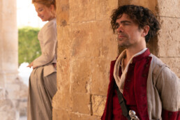 Haley Bennett stars as Roxanne and Peter Dinklage as Cyrano in Joe Wright’s Cyrano.