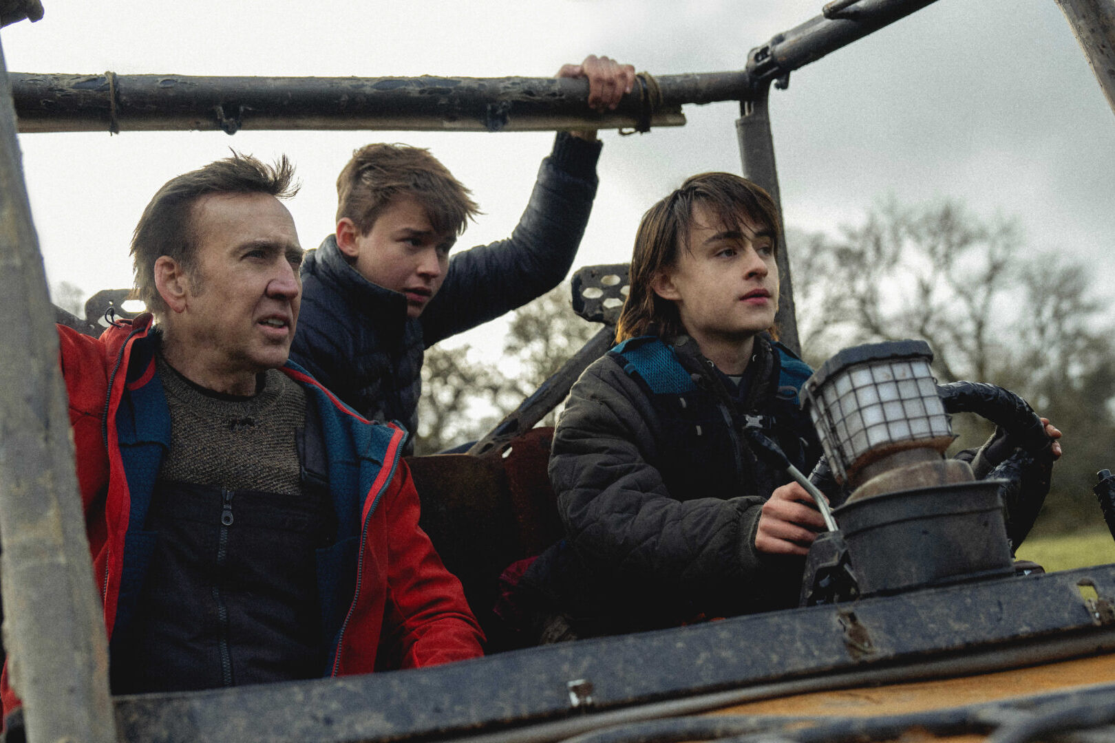 Nicolas Cage, Maxwell Jenkins, and Jaeden Martell in ARCADIAN, a film by Benjamin Brewer. Courtesy of RLJE Films and Shudder. An RLJE Films and Shudder Release.