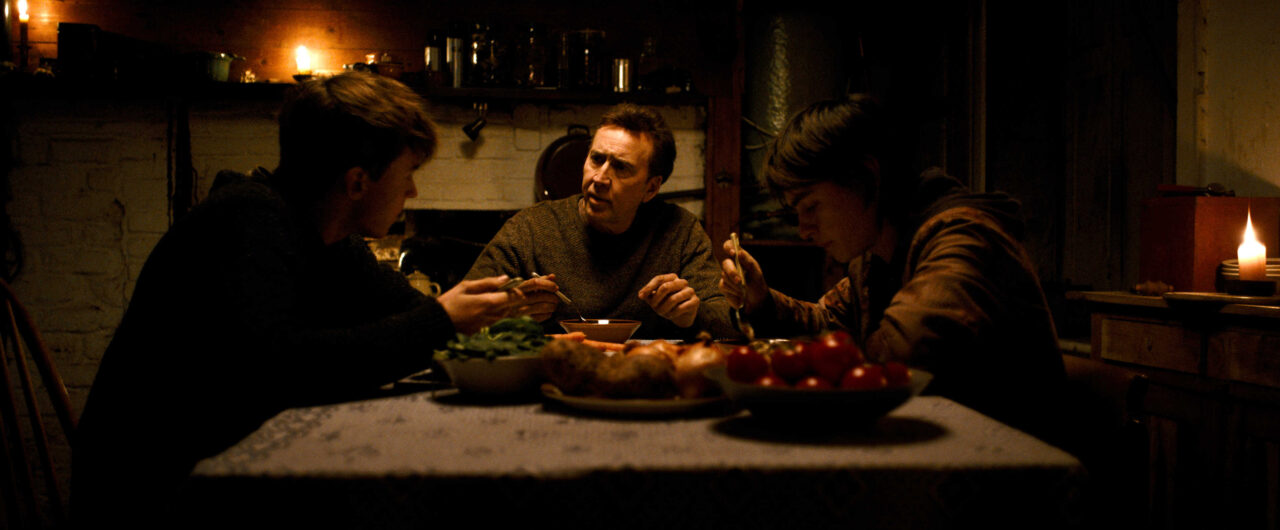 Maxwell Jenkins, Nicolas Cage, and Jaeden Martell in Benjamin Brewer’s ARCADIAN. Photo Credit: Courtesy of RLJE Films and Shudder. An RLJE Films and Shudder Release.