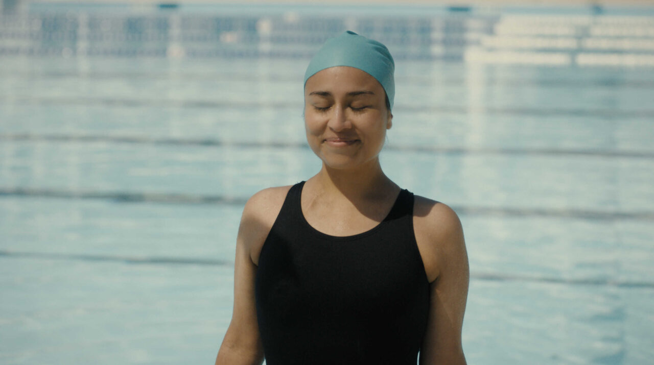 "The journey is not literally about the swimming, or say, her being entitled to anything. It’s about her essentially asking for access to opportunity, to be seen as a human in all aspects of her life – even to herself." Pictured: Evelyn Llorena in a still from 'Gabriela.' Photo credit: Nouvelle Entertainment